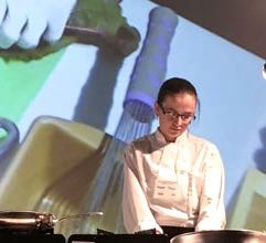 Sous chef Heather Minter of The White Dog Bistro prepares blue catfish as symposium participants look on. ©Chris Patrick/VASG.